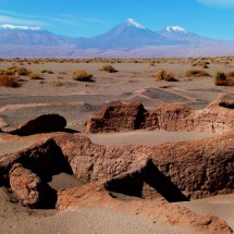 One of the ruins of Tulor with the Volcanoes Licancabur and Juriques in the background